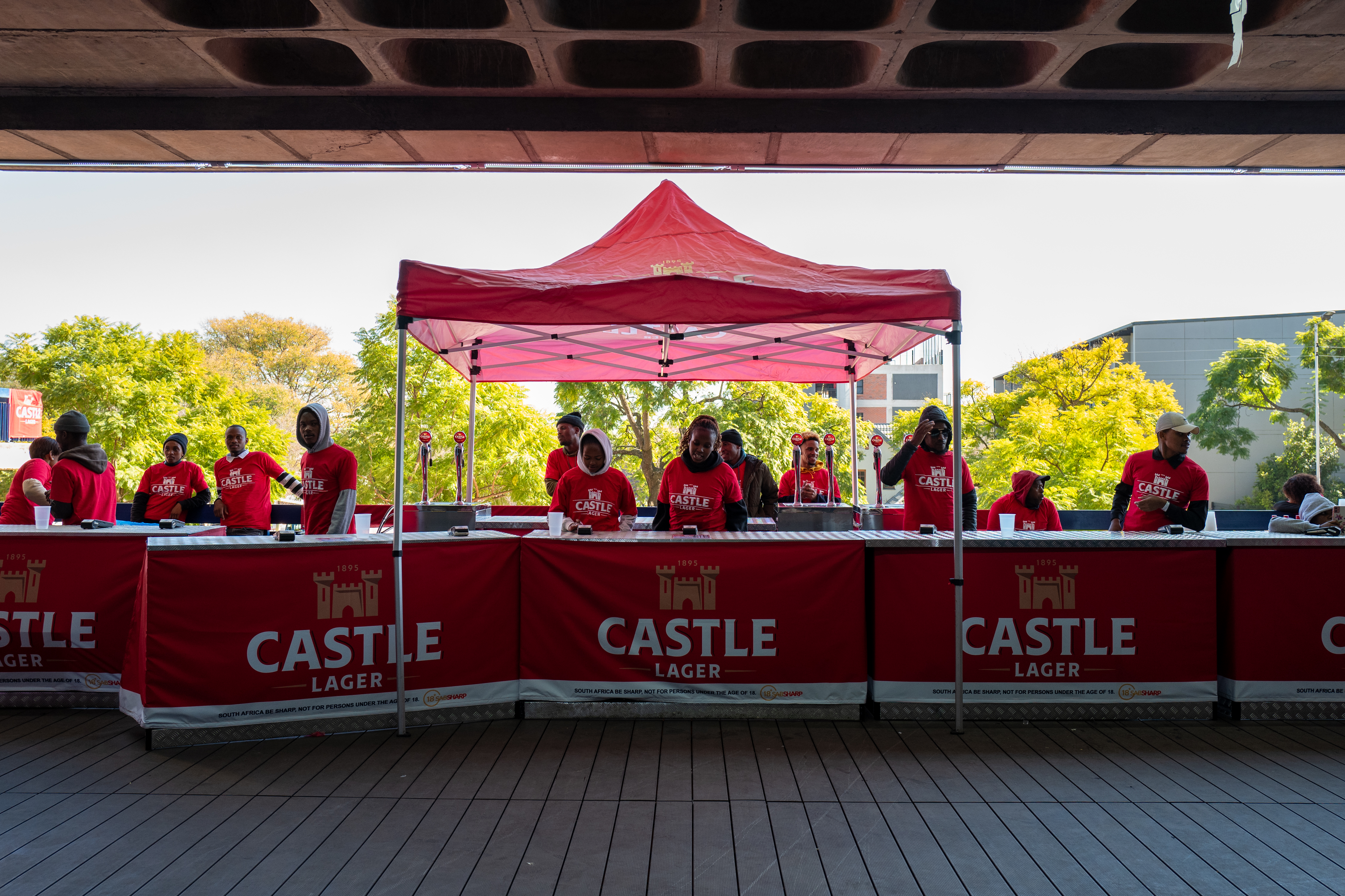 Castle Lager promotional bar with full service team at professional event