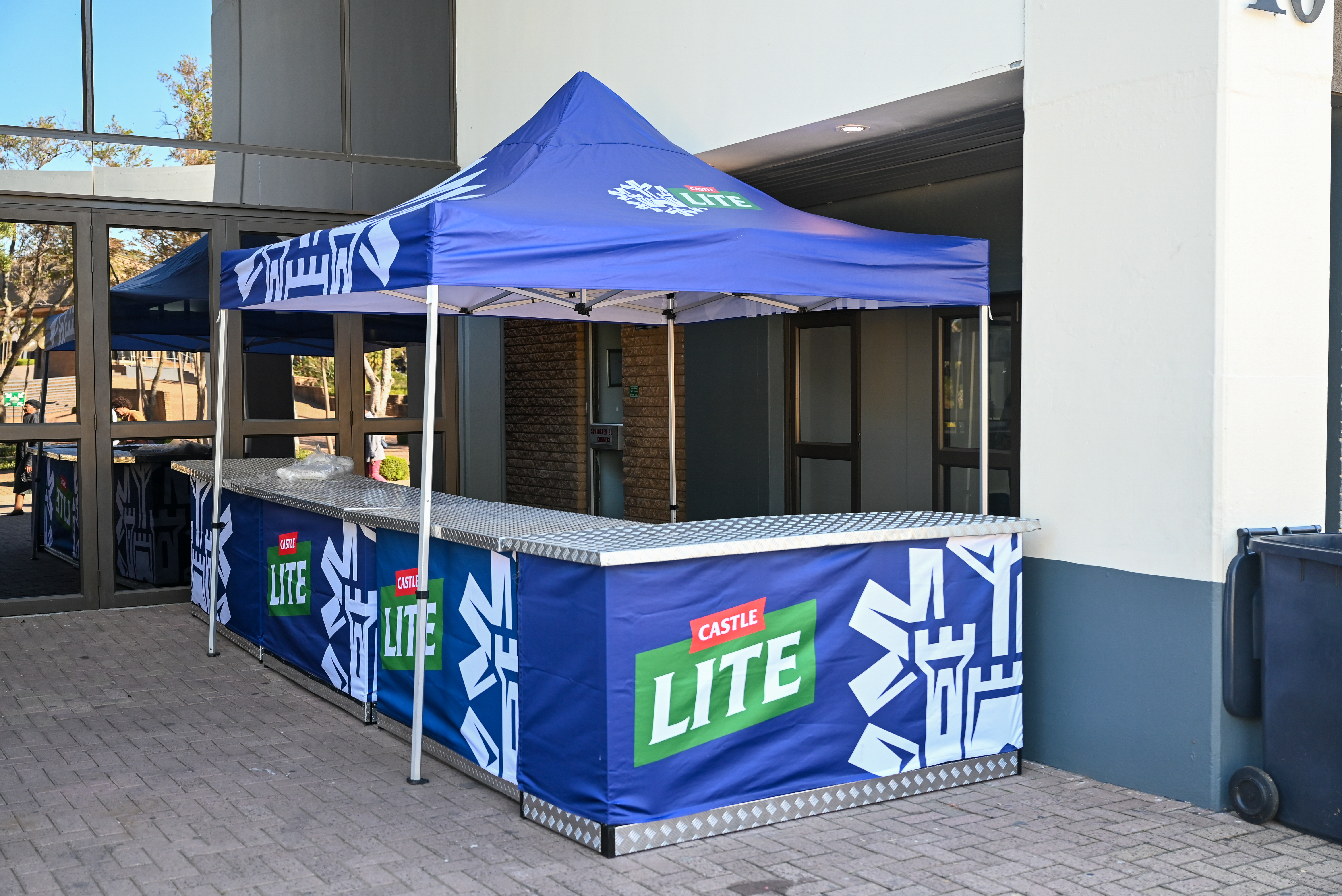 Professional Castle Lite branded portable bar setup at South African promotional event